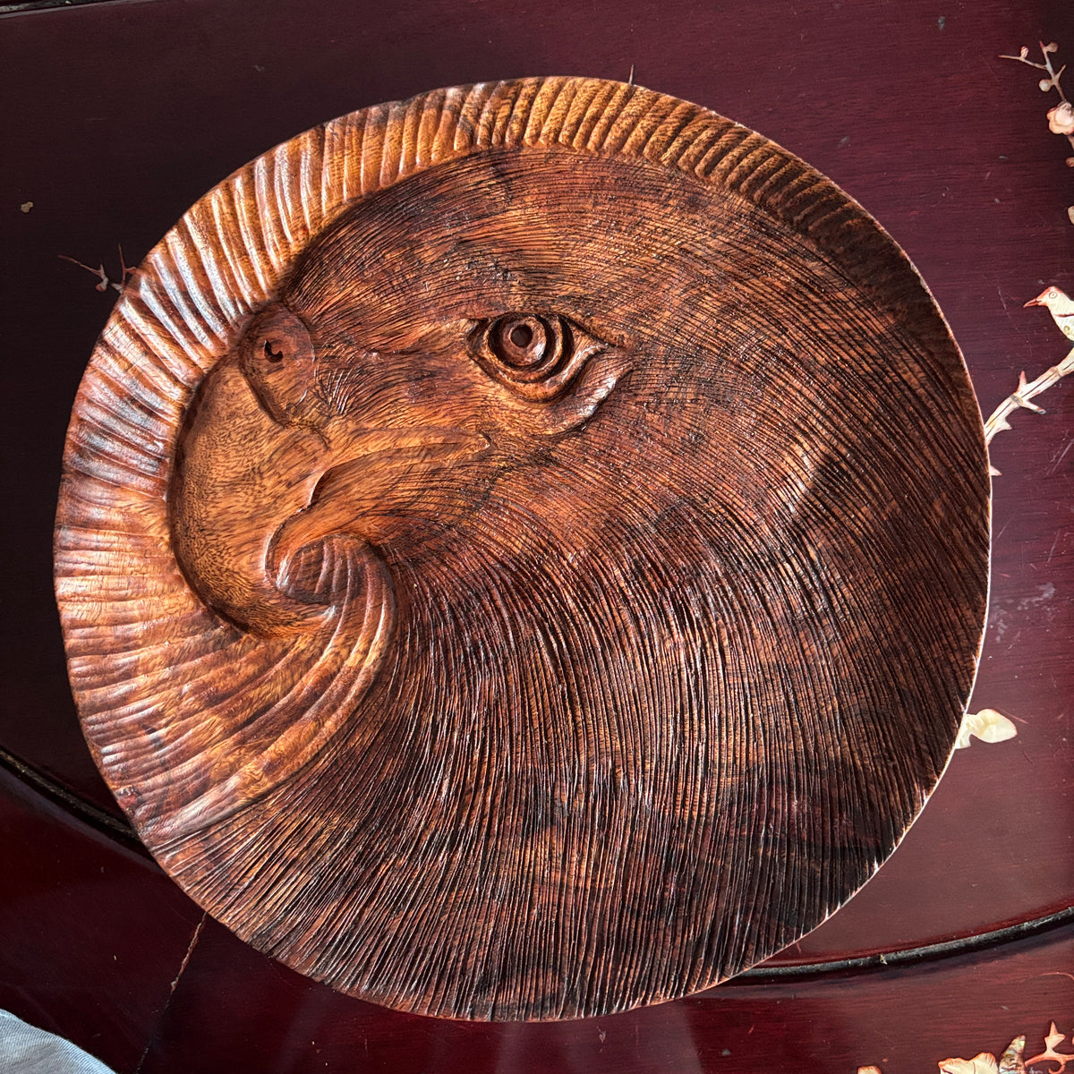 Eagle tray: round wooden tray with an eagle-head motif and sweeping carved lines. — Wooden Tray